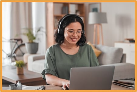 Woman working remotely on a laptop, representing modern tax planning and virtual consultations with tax advisors.