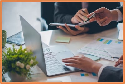 Team of business professionals collaborating on financial planning and asset acquisition strategies, analyzing data to decide between purchasing or leasing equipment.