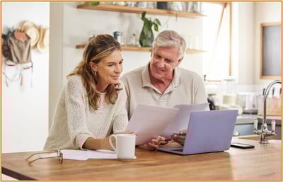 Married couple reviewing retirement savings plan together at home