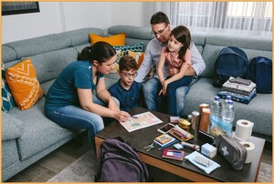 Homeowner reviewing documents with a contractor or insurance adjuster, representing the process of documenting losses and claiming tax relief after a disaster.