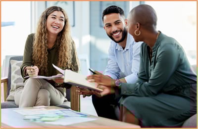 Group of diverse professionals smiling and meeting together, symbolizing the importance of seeking expert tax planning and financial advice to navigate new tax law changes.