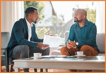Business advisor discussing new depreciation tax law changes and planning strategies with a client, highlighting the importance of professional guidance for maximizing first-year bonus depreciation and Section 179 deductions.