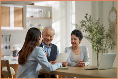 Senior couple meeting with a financial advisor to discuss estate planning and maximizing their federal estate tax exemption.
